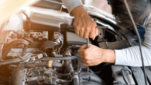 Mechanic working on car engine maintenance, Transmission Auto Repair Near Me