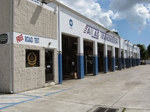 Atlas Transmission shopfront with free road test sign.