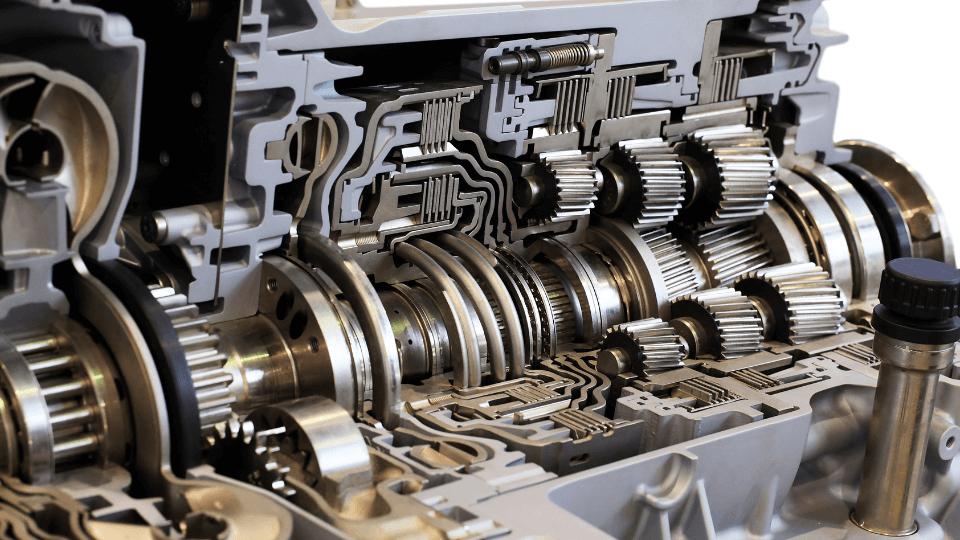 Close-up of complex mechanical gears in engine.